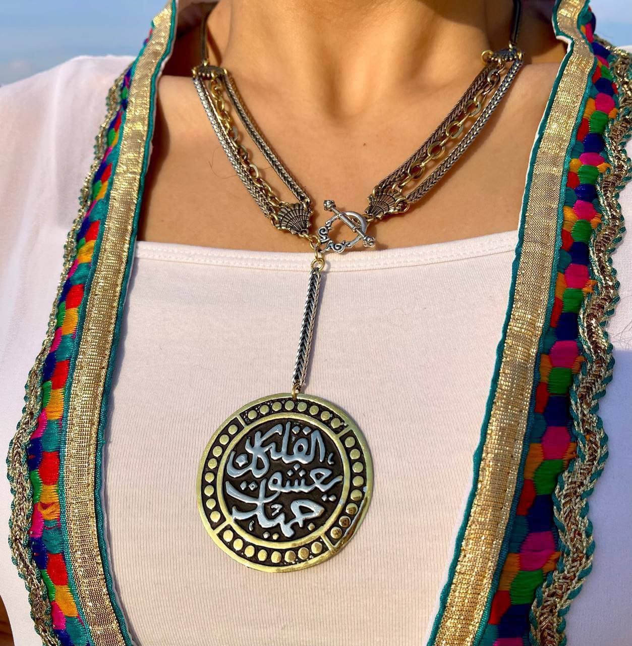 Dual-Tone Arabic Calligraphy Necklace – The heart falls in love with everything beautiful